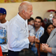 Joe Biden is given a rosary while meeting with patrons, alongside Hilda Solis (L), Former United States Secretary of Labor and a member of the Los Angeles County Board of Supervisors in Los Angeles, Calif. on July 19, 2019.